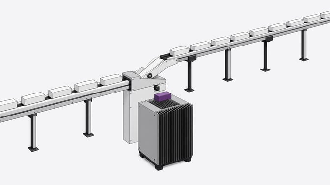 A mechanical routing junction directing solid blank blocks either directly into a local finned processing enclosure or onto a long, elevated transit rail for external processing.