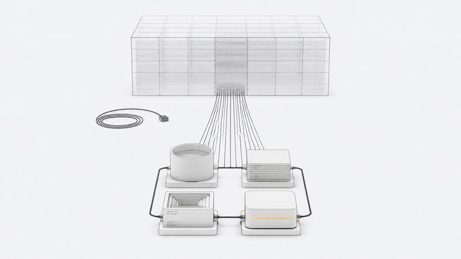 A distant abstract data-center block sits disconnected from a compact local cluster of four unlabeled service modules linked in a closed loop on a table, illustrating locally emulated cloud services.